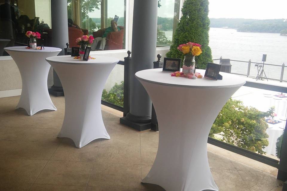 Cocktail tables on balcony at wedding