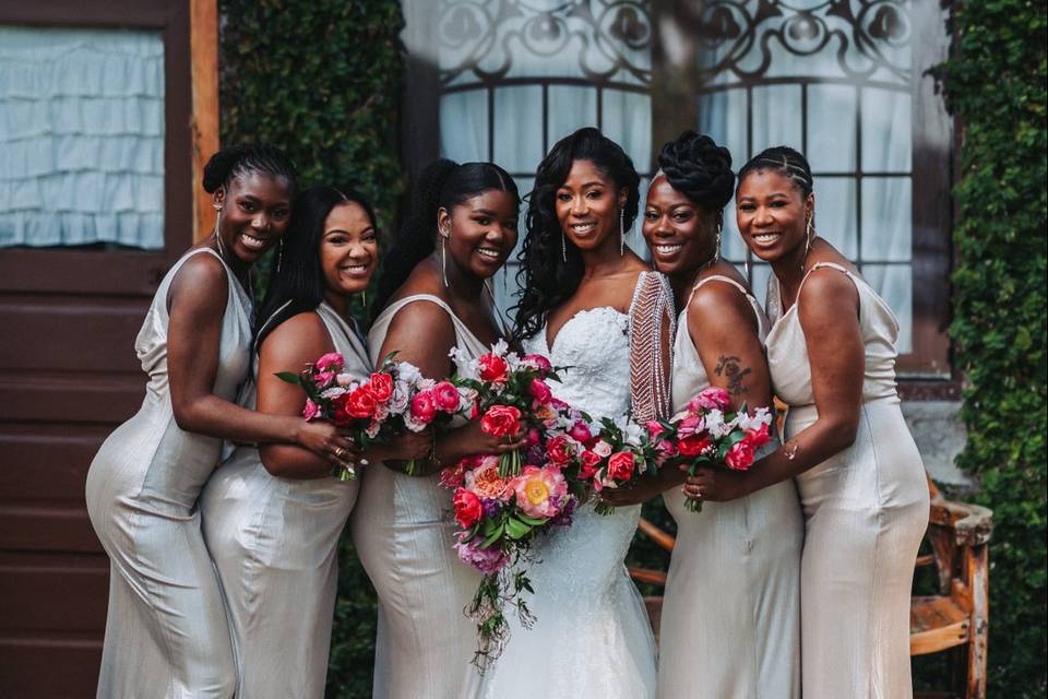 Bridemaids in front of suite
