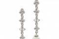 SELENE PEARL & CRYSTAL DANGLES
Delicately bound to a line of hand set, marquis-cut cubic zirconia stones, these earrings' lustrous glass pearl creates a wonderful contrast between classic and glamorous. With a hint of sparkle, the pair is a wonderful adornment to your visage. For a high quality finish, they are set in a rhodium plating.
http://www.delilahk.com/delilahkbridal/bridal-earrings/selene-pearl-crystal-dangles.html