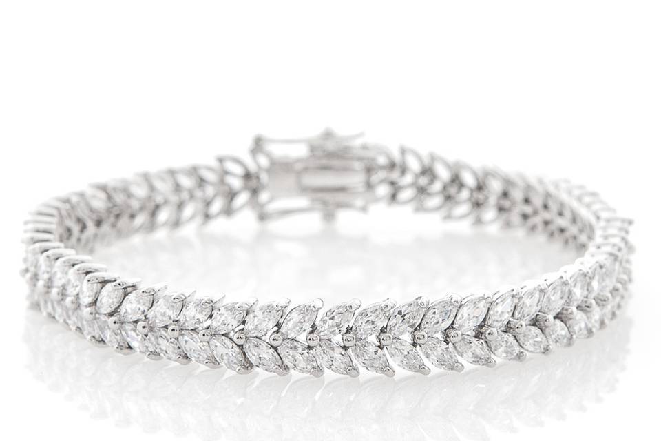 CLARA LEAF BRACELET
This handcrafted rhodium plated bracelet is embellished with marquis-cut cubic zirconia stones set in a leaflike pattern, bringing life to your look du jour. A delicate and elegant design, the Clara leaf bracelet is a wonderful bridal accessory. Wear it with clear crystal dangles for maximum impact.
http://www.delilahk.com/delilahkbridal/bridal-party/mother-of-the-bride/clara-leaf-bracelet.html