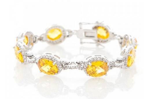 MAELYS CITRINE CRYSTAL BRACELET
A truly classic gem, the citrine yellow Maelys bracelet is delicately hand set with the finest cubic zirconia stones on a rhodium plated base for a high quality finish. This colorful piece is sure to shimmer in any type of light. Wear it with crystal dangles for an overall alluring look.
http://www.delilahk.com/delilahkbridal/maelys-citrine-crystal-bracelet.html