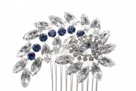 BLUSHING BLUES CRYSTAL HAIR COMB
Set in a coiling fashion, this hair comb is embellished with marquis and round cut stones, adding glamour and elegance to your do. Each hand set faceted stone dazzles in even the lowest of lighting, making this piece a wonderful accent to your veil.
http://www.delilahk.com/delilahkbridal/bridal-party/something-blue/blushing-blues-crystal-hair-comb.html