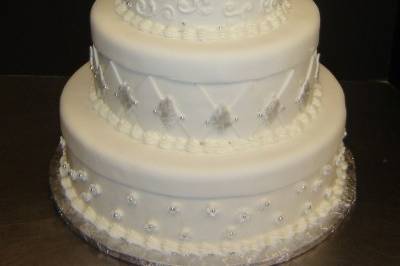 Amazing all white cake with varying textures and pearling across layers.