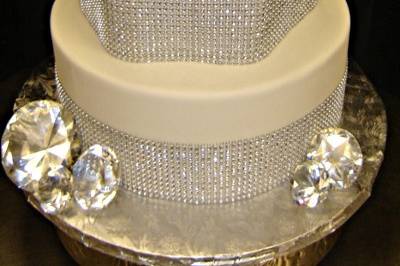 Shapely cake with ribbons of diamond like sparkles--diamond toppers for some extra shine!