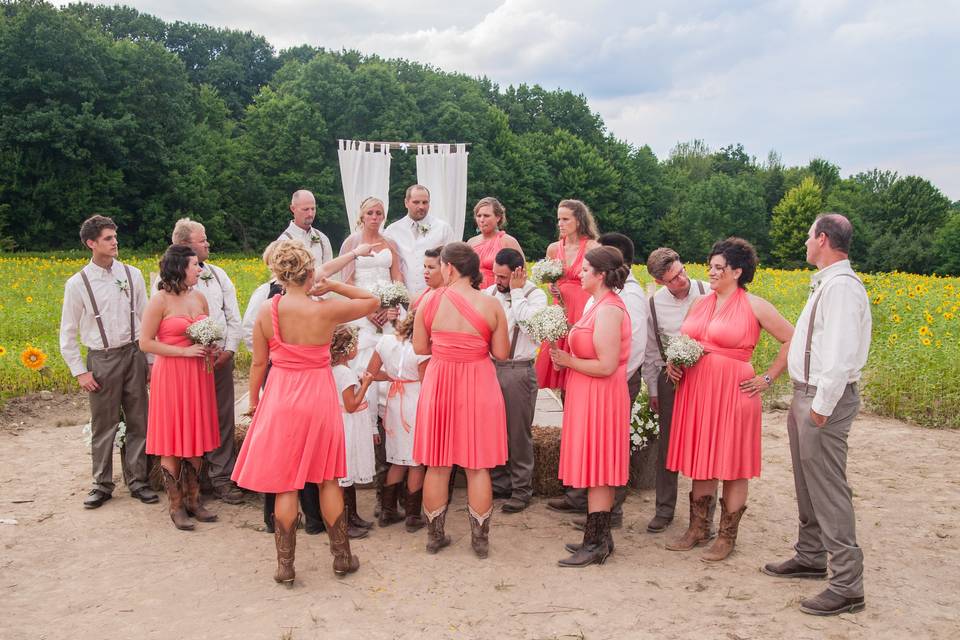 The couple with the bridesmaids and groomsmen