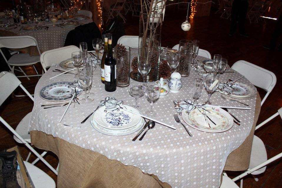 Table setting with mixed-matched china with also mixed-matched wine and champagne