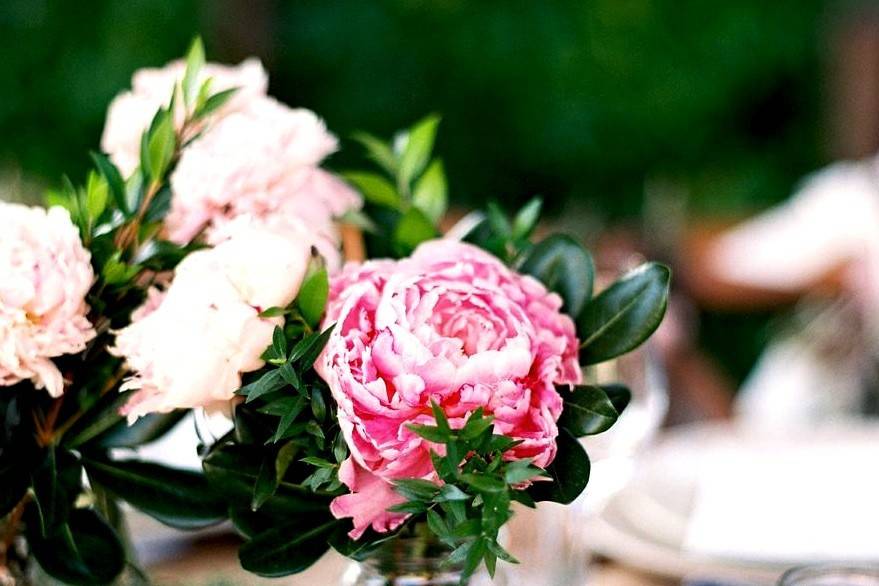 Peonies, pittosporum and myrtle table arrangements