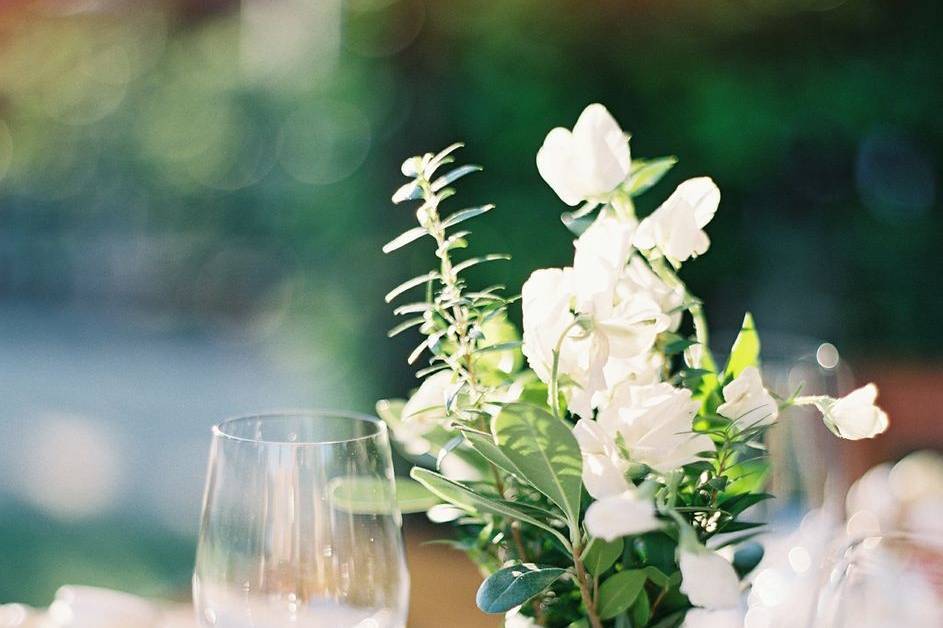 Table arrangement with Sweet Peas, Myrtle, Eucalyptus, and Pittosporum