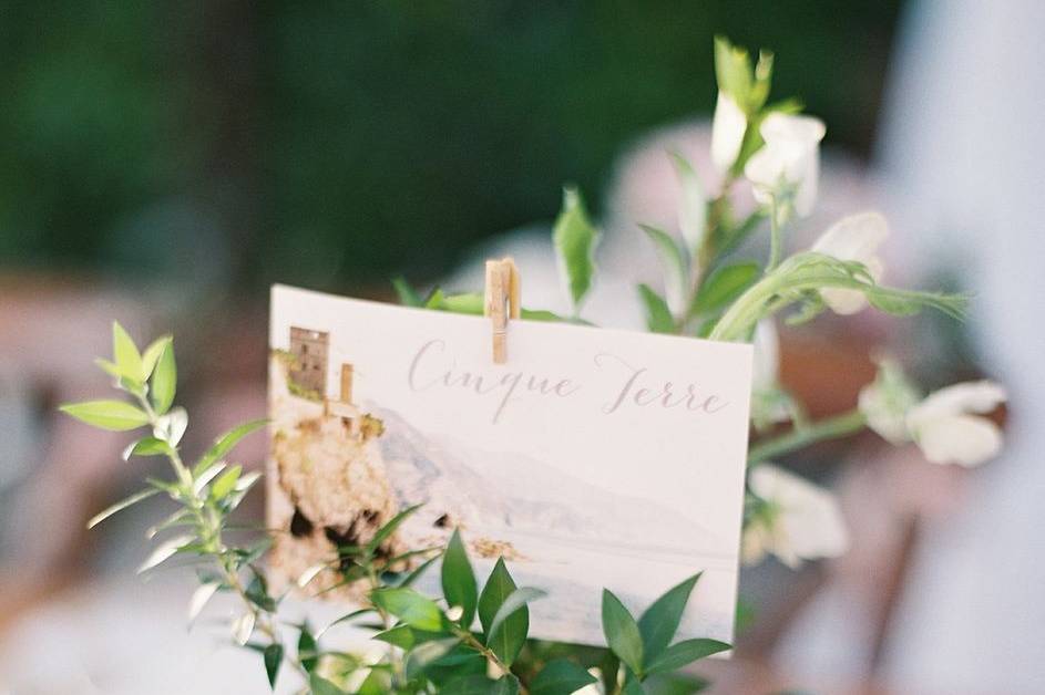 Place Marker arrangement with Sweet Peas, Myrtle, and Pittosporum