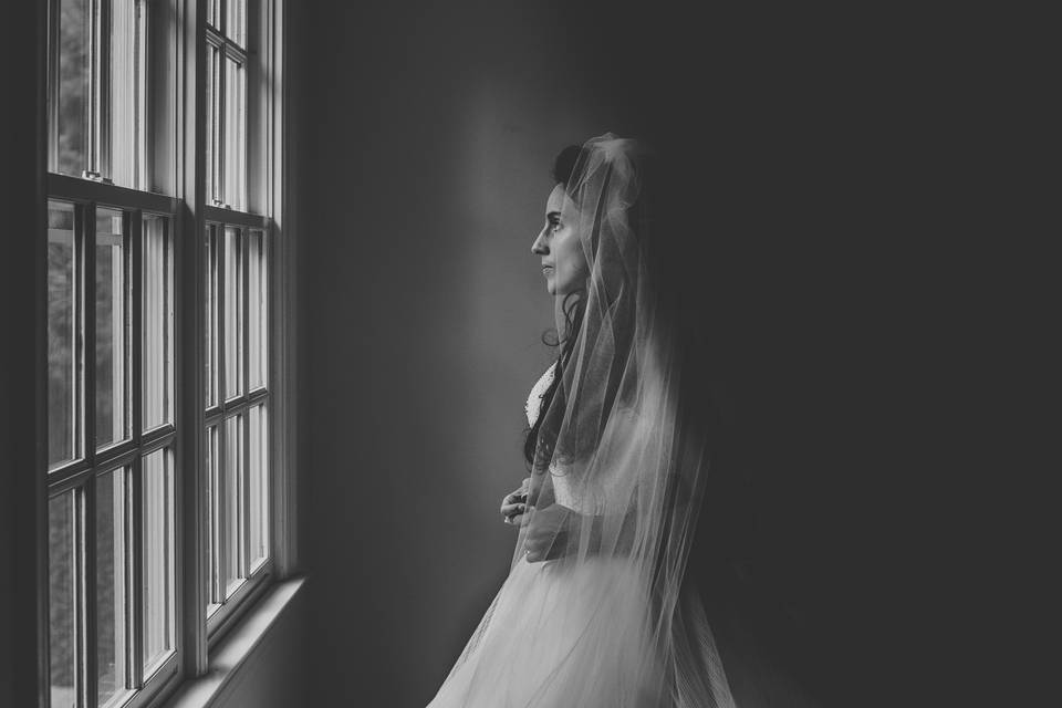 Bride gazing out window