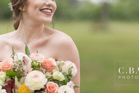 Bride looking at bouquet