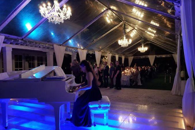 Pianist on Glass Covered Pool