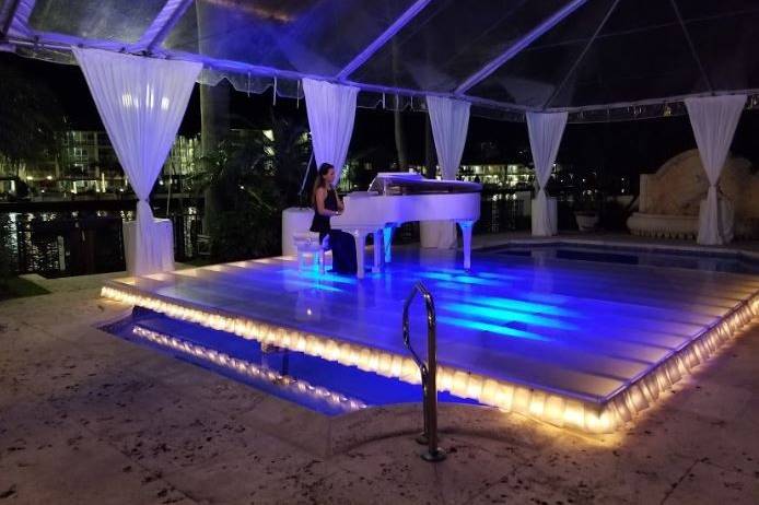 Pianist on Glass Covered Pool