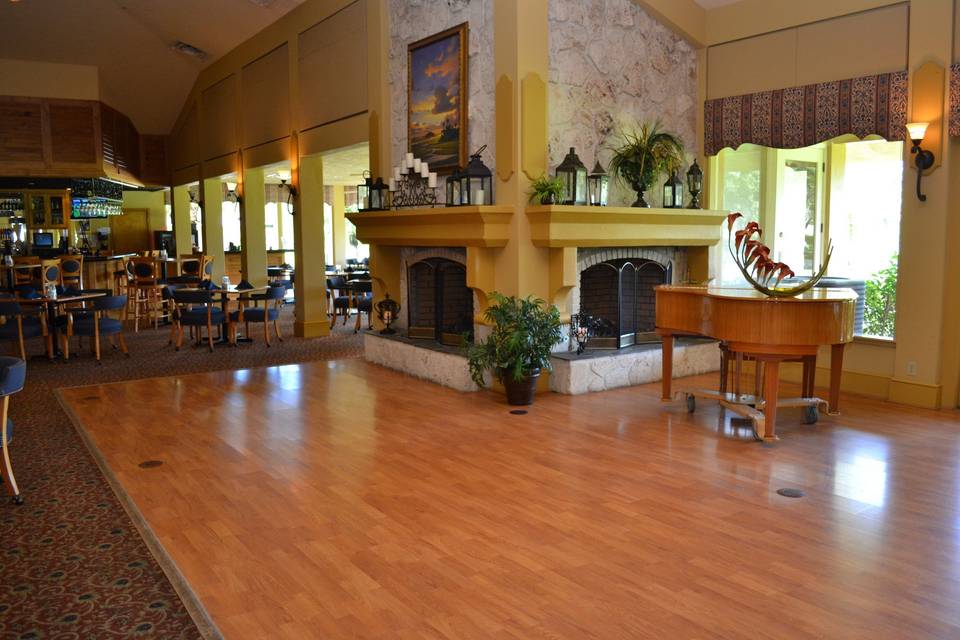 The dance floor is surrounded by charm with double fireplaces and windows to let the light in for an evening event