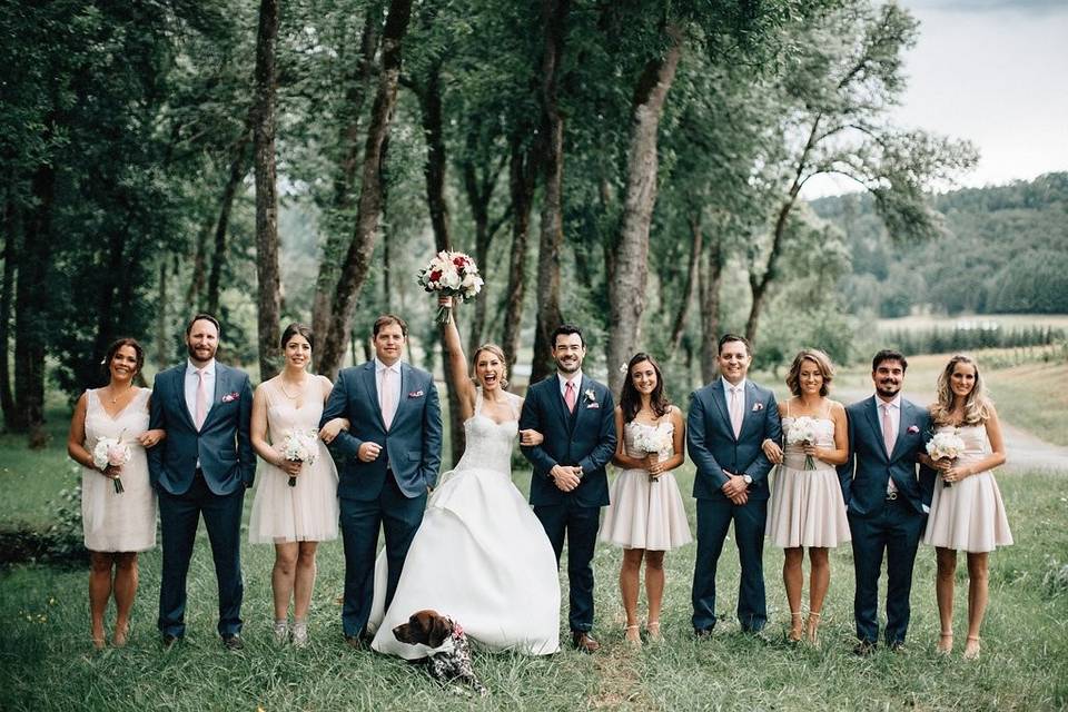 The couple with the bridesmaids and groomsmen