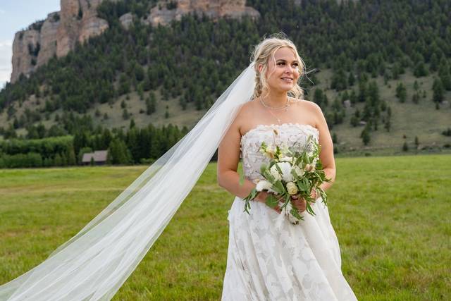 Bride with bouquet, mountains