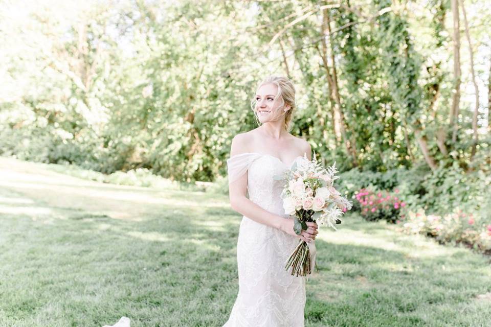 Bride posing in sunlight