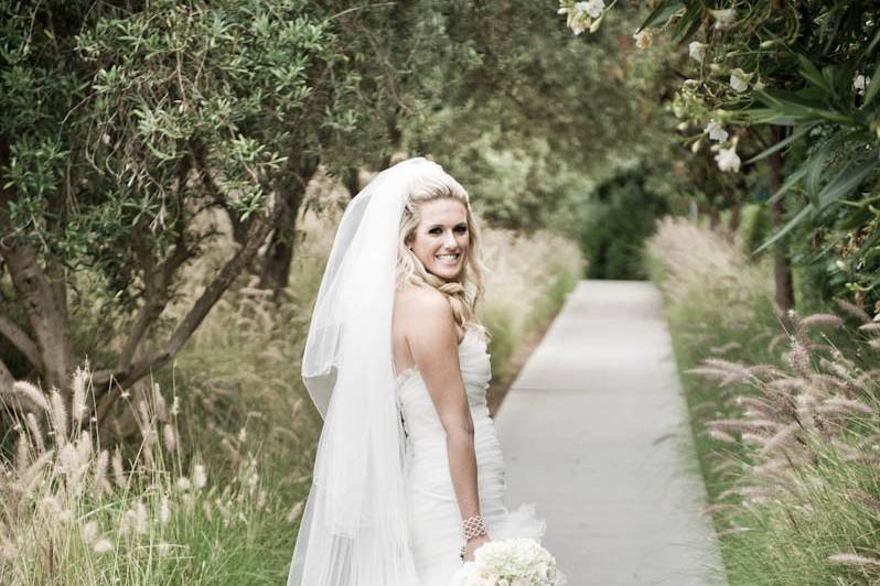 Gown designed by Rose DeSimone created in Silk Dupioni bodice with Hand Pleated Silk Organza layered skirt.