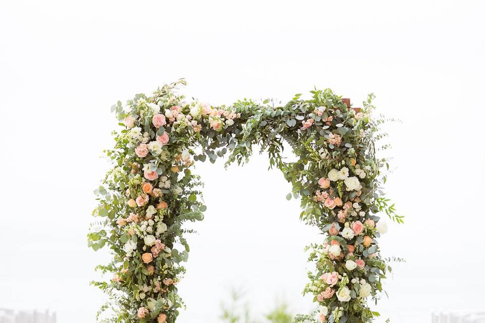 Floral arch with pampas aisle