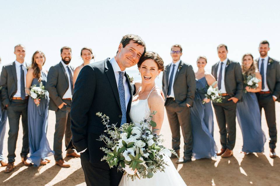 The couple with the bridesmaids and groomsmen