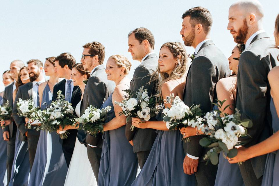 The couple with the bridesmaids and groomsmen