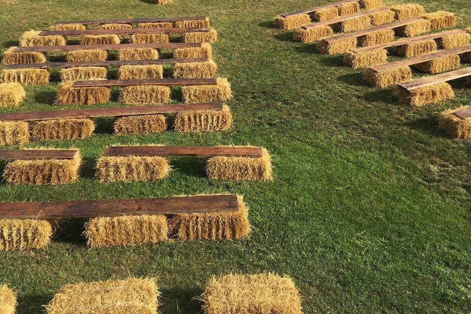 We repurposed the old floor planks for seating on our straw bales