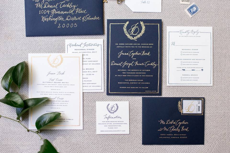 Flourishing Penguin navy and gold foil invitation with hand drawn crest and border and custom calligraphy letterpress