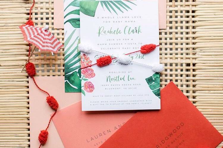 Flourishing Penguin baby shower invitation with watercolor greenery, pinata fringe envelope liners and pom pom trim