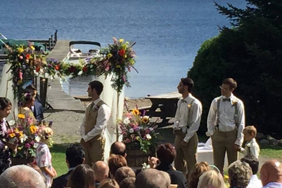 Custom made white birch arch. Beautifully decorated with white fabric, whiskey barrels and gorgeous flowers. Stunning wedding on the Sacandaga Lake