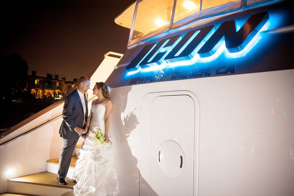 Beautiful photo of Bride and Groom on the stern of yacht ICON