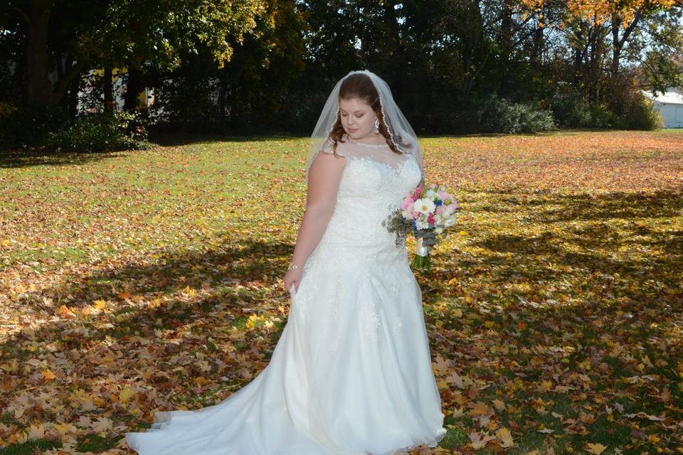 Bride by the autumn leaves