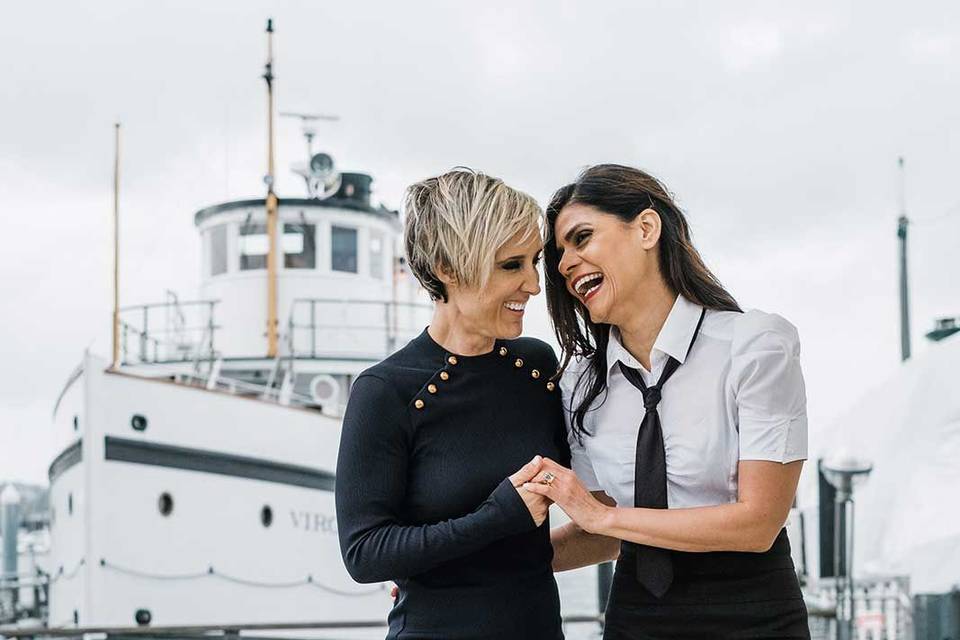 A lesbian couple laughs before their downtown Seattle elopement.