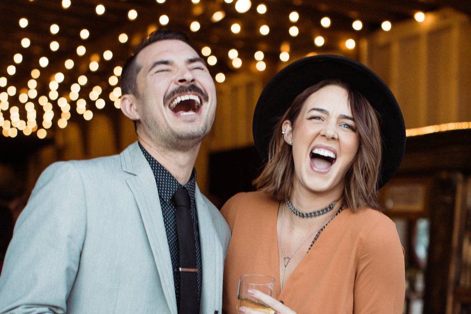 Two guests laugh at a wedding at the MV Skansonia.