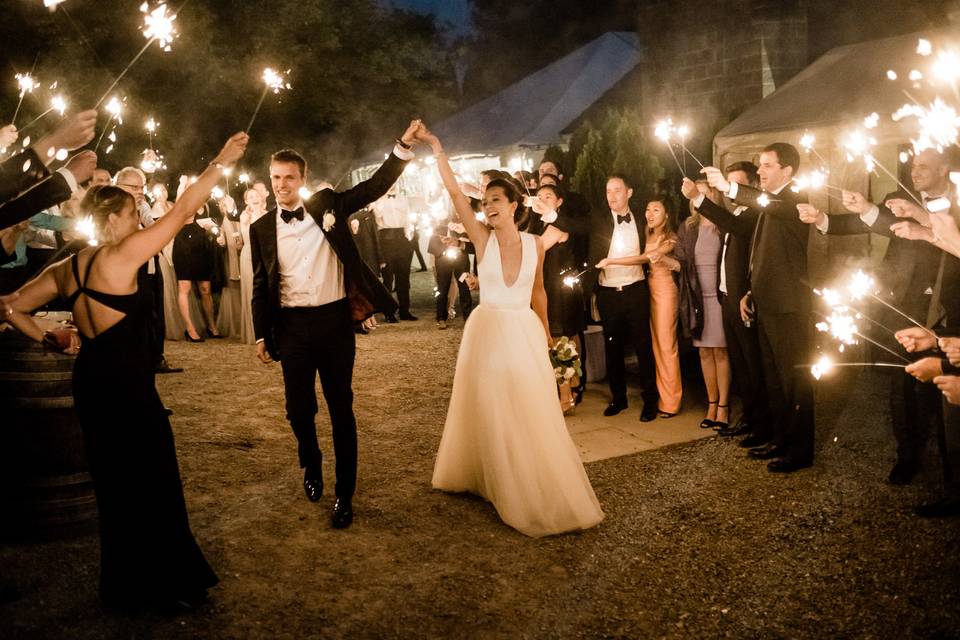 The bride and groom exit to sparklers at DeLille Cellars.