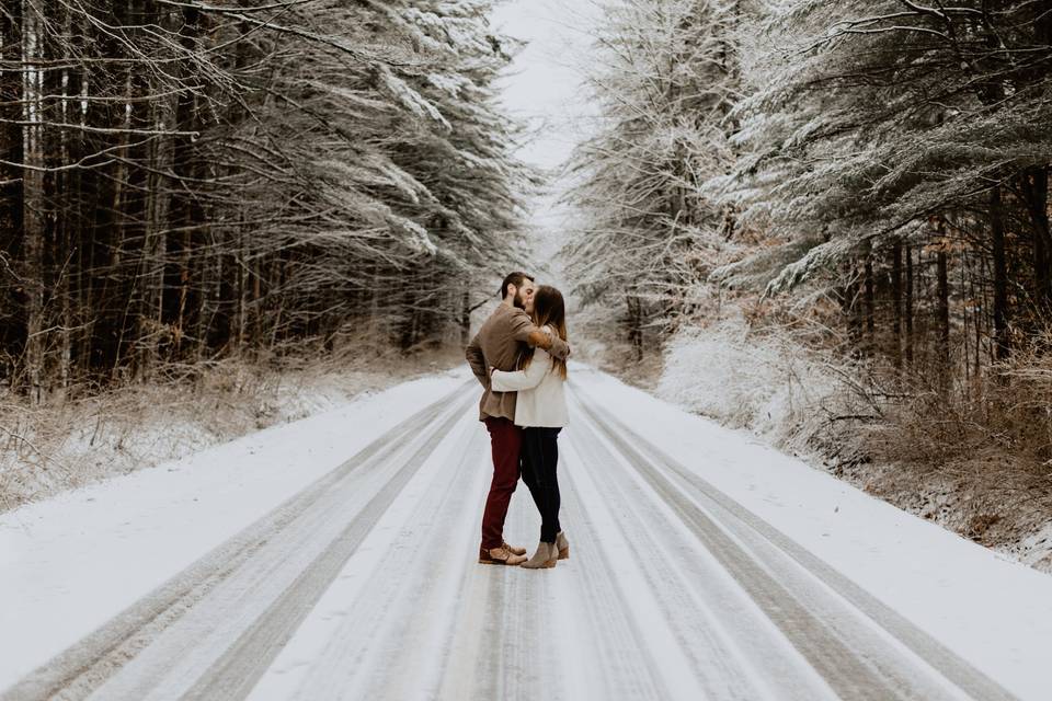 Kissing on a snowy road