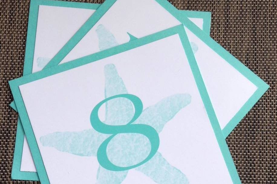 Turquoise beach themed table numbers