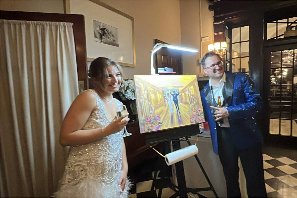 Happy couple with their painti