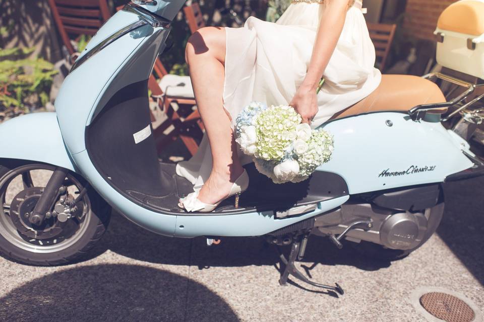 Pale shades of blue and green hydrangeas are highlighted by creamy white peonies in the clean and simple bouquet.