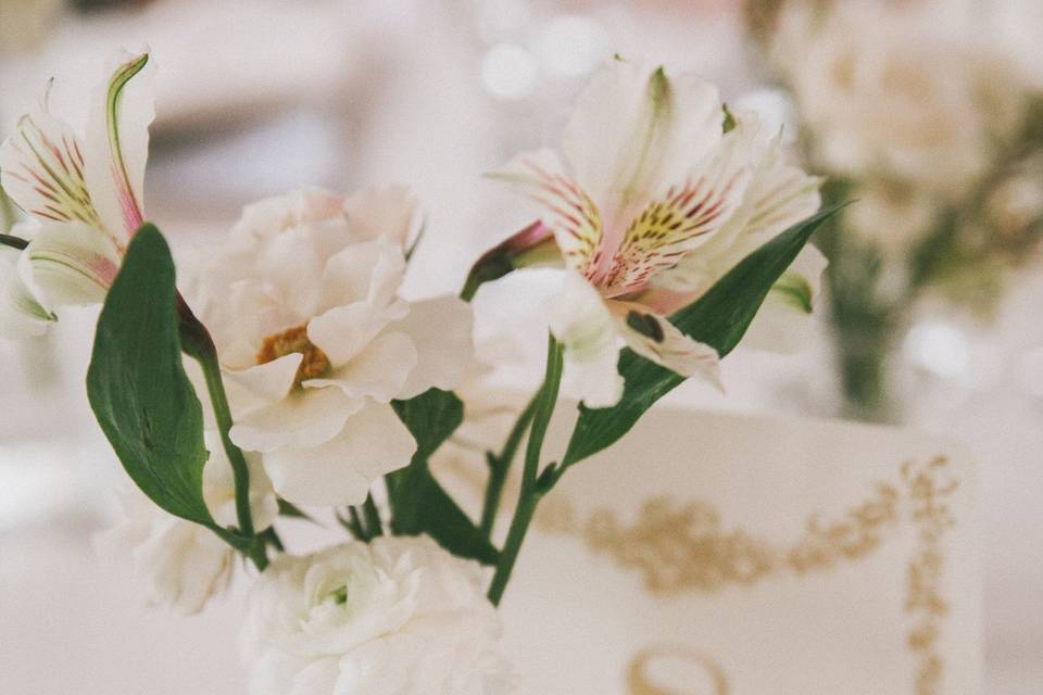 Bud vases with sweetheart roses and alstroemeria.