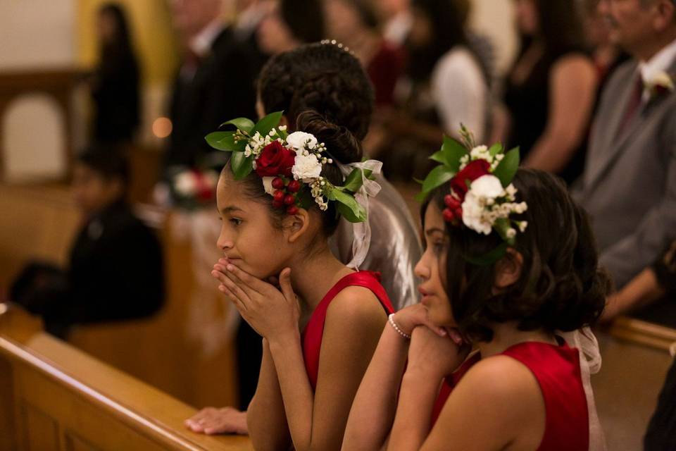 Flower crowns that included red and white roses, accents, and ruscus.