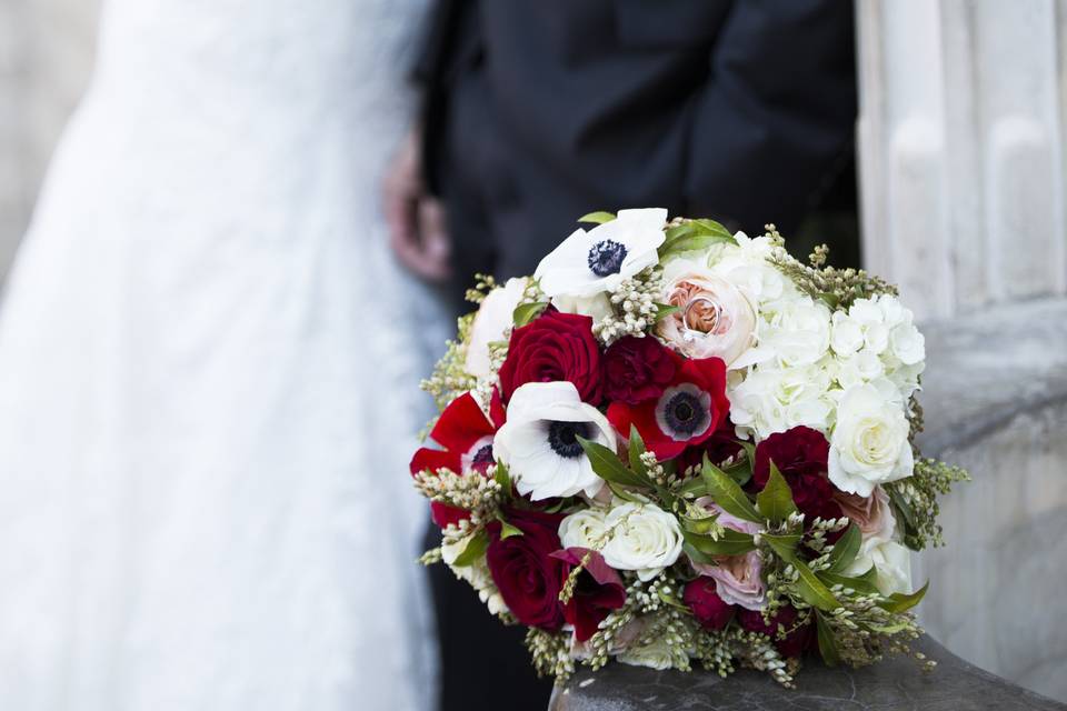 Spanish/Vintage inspired bouquet.  Included red & white anemones, andromeda, roses, ranunculus, mini carnations, hydrangea and garden roses.