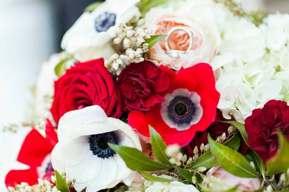 Spanish/Vintage inspired bouquet.  Included red & white anemones, andromeda, roses, ranunculus, mini carnations, hydrangea and garden roses.