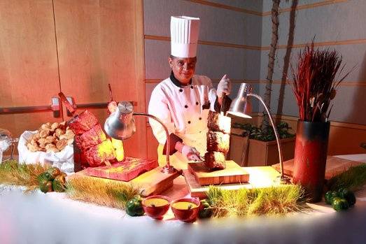 Brazilian style Churrascaria Carving Station. All meats are Fire Pit roasted and carved off Large Skewers.