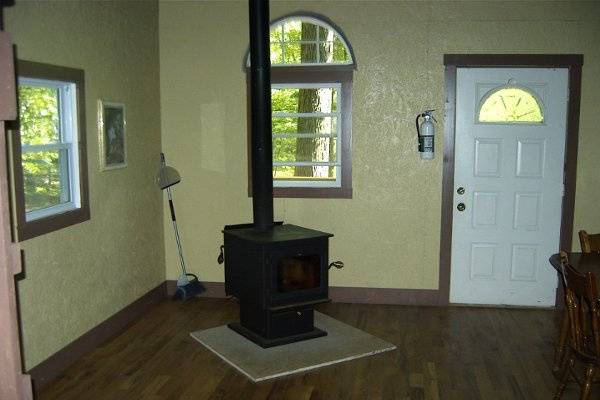 The wood stoves have glass in front so you can see the fire, a queen and a double and two single built in bunks w/comfortable matresses. You need to bring sheets, bedding, a lantern and cookware.