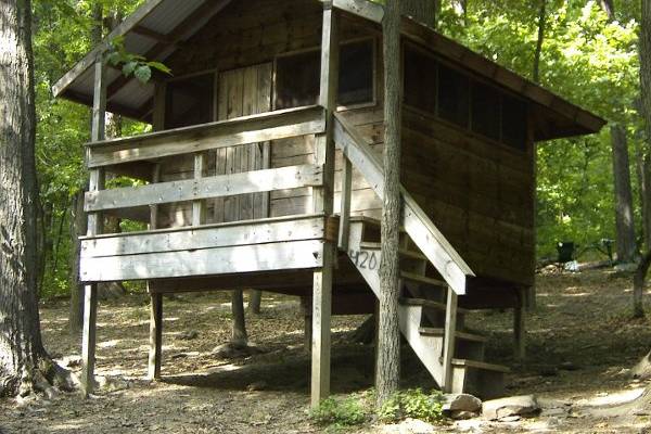 We have 8 tree houses.  They are rustic camping, but up off the ground, if it rains, you will stay dry.  You'll need to bring an air matress.  The site has a fire circle, pic-nic table, and grill.