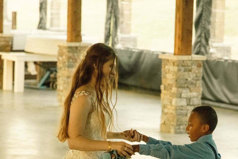 Bride dancing with kid