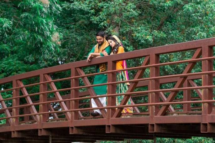 Couple revel in the future atop a bridge