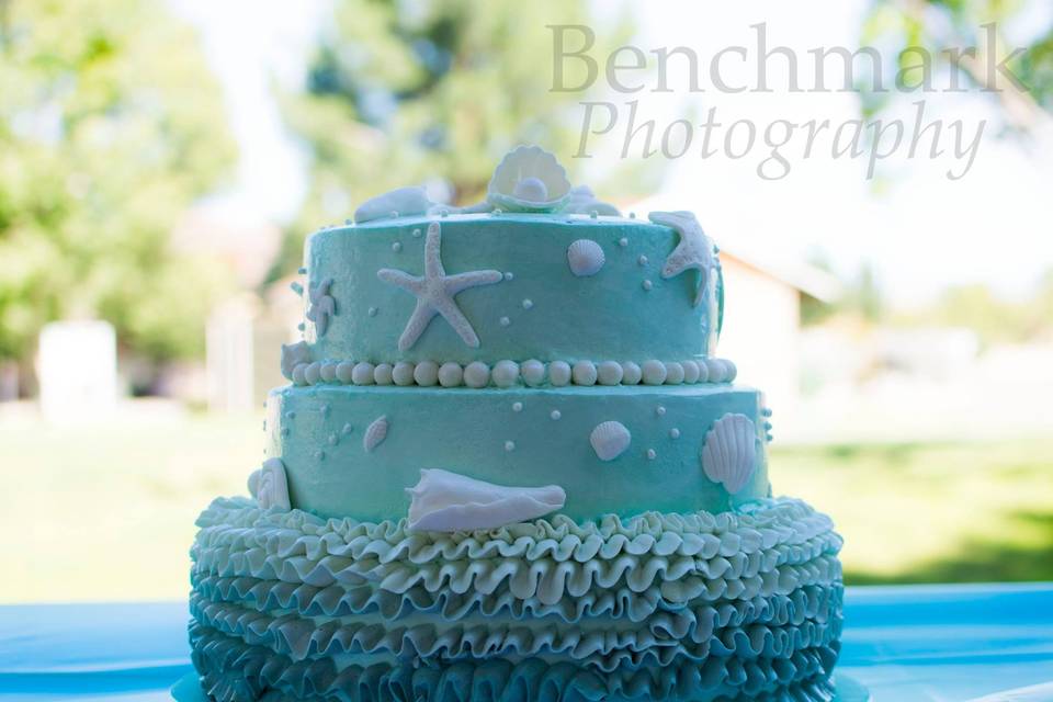 Ombre ruffle, ocean themed cake