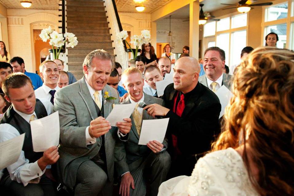 Groomsmen serenading bride