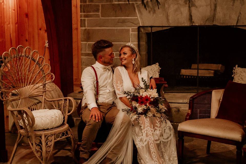 Newlyweds by the fireplace